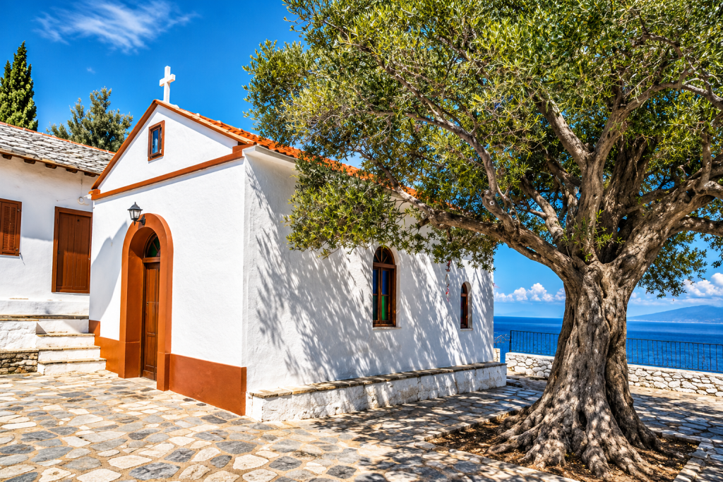Agios Ioannis Kastri chapel on Skopelos above the Aegean Sea, reached by a stone staircase.