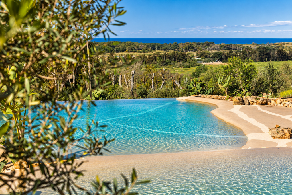 Swimming pool at Masseria Fontanelle with views towards the Salento coast.